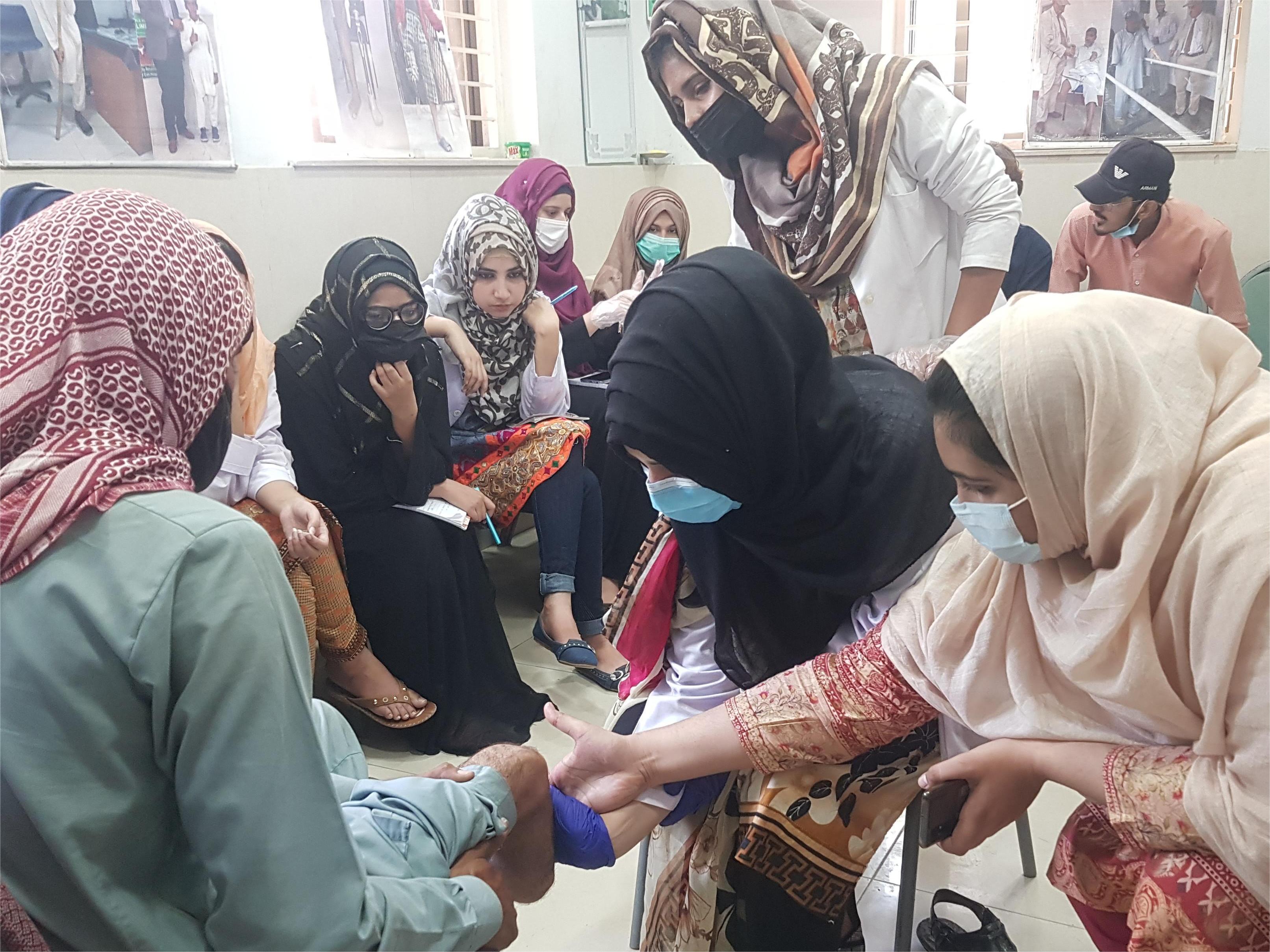 Patient practicing fine motor skills with prosthetic hand